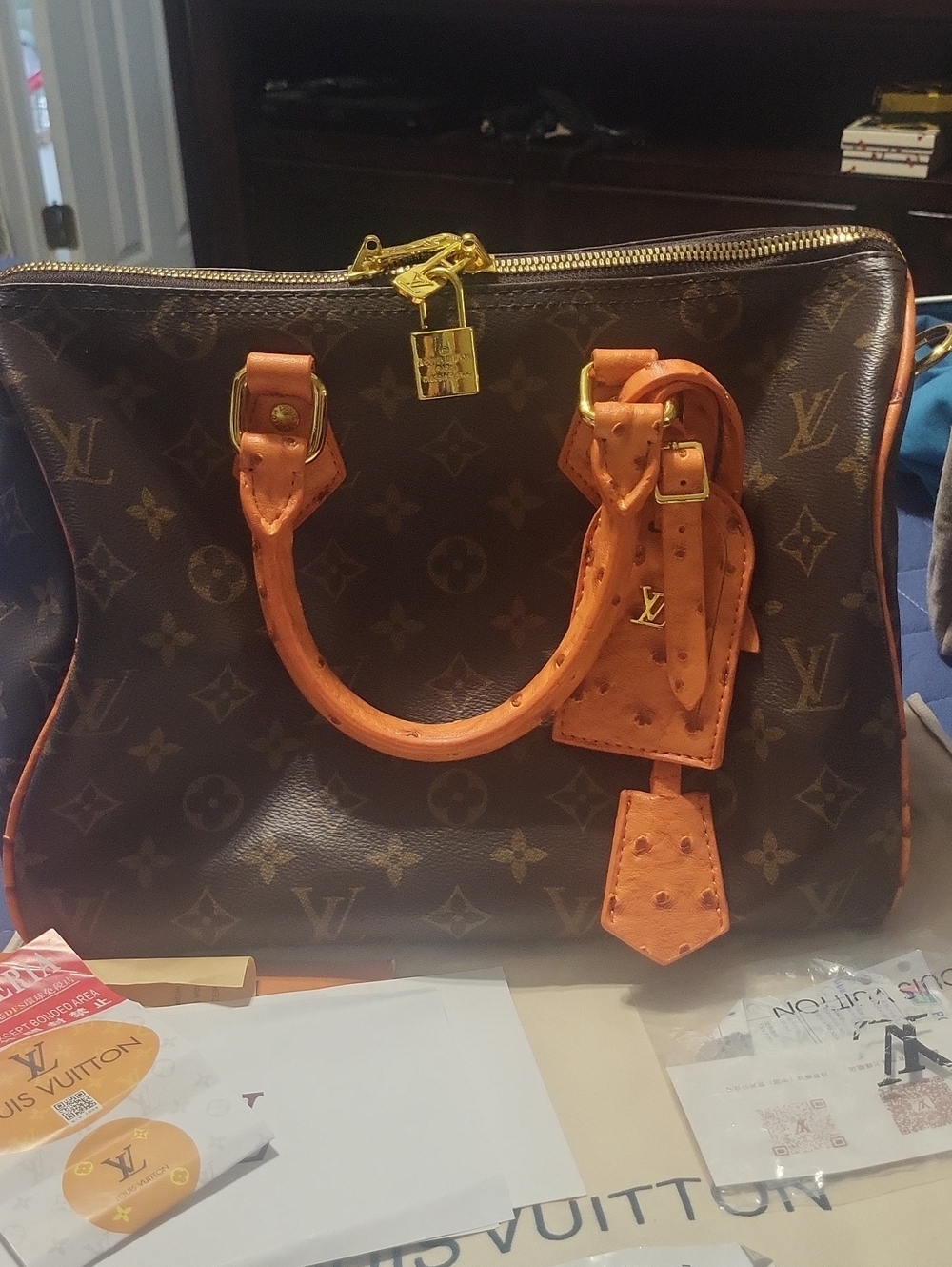 Louis Vuitton Brown Monogram Canvas Handbag with Ostrich Print Trim. Brand New,